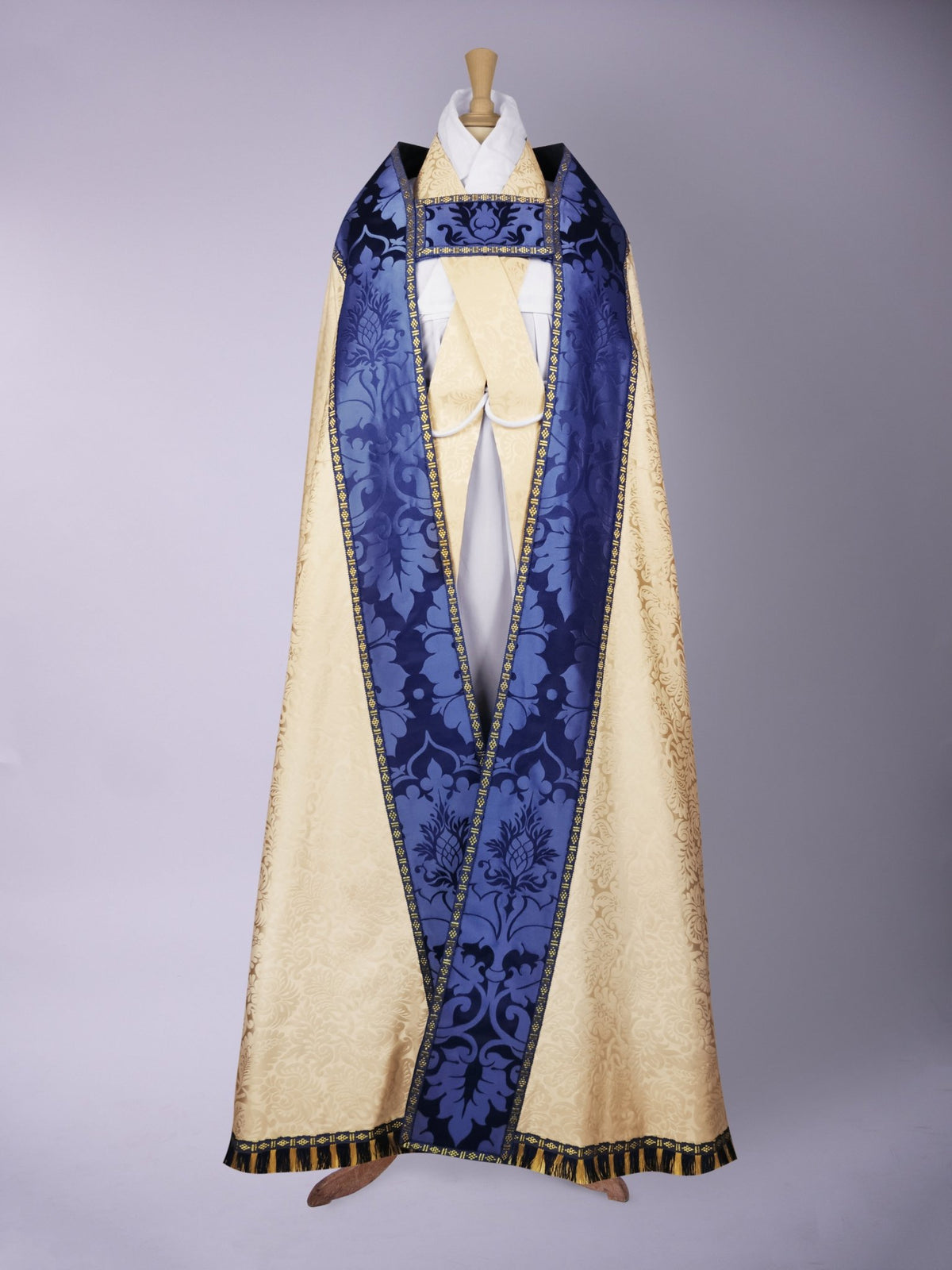 Minster Cope in Cream 'Holbein' with Blue 'Bellini' Orphreys and Sacred/Immaculate Heart Embroidered Hood - Watts & Co.
