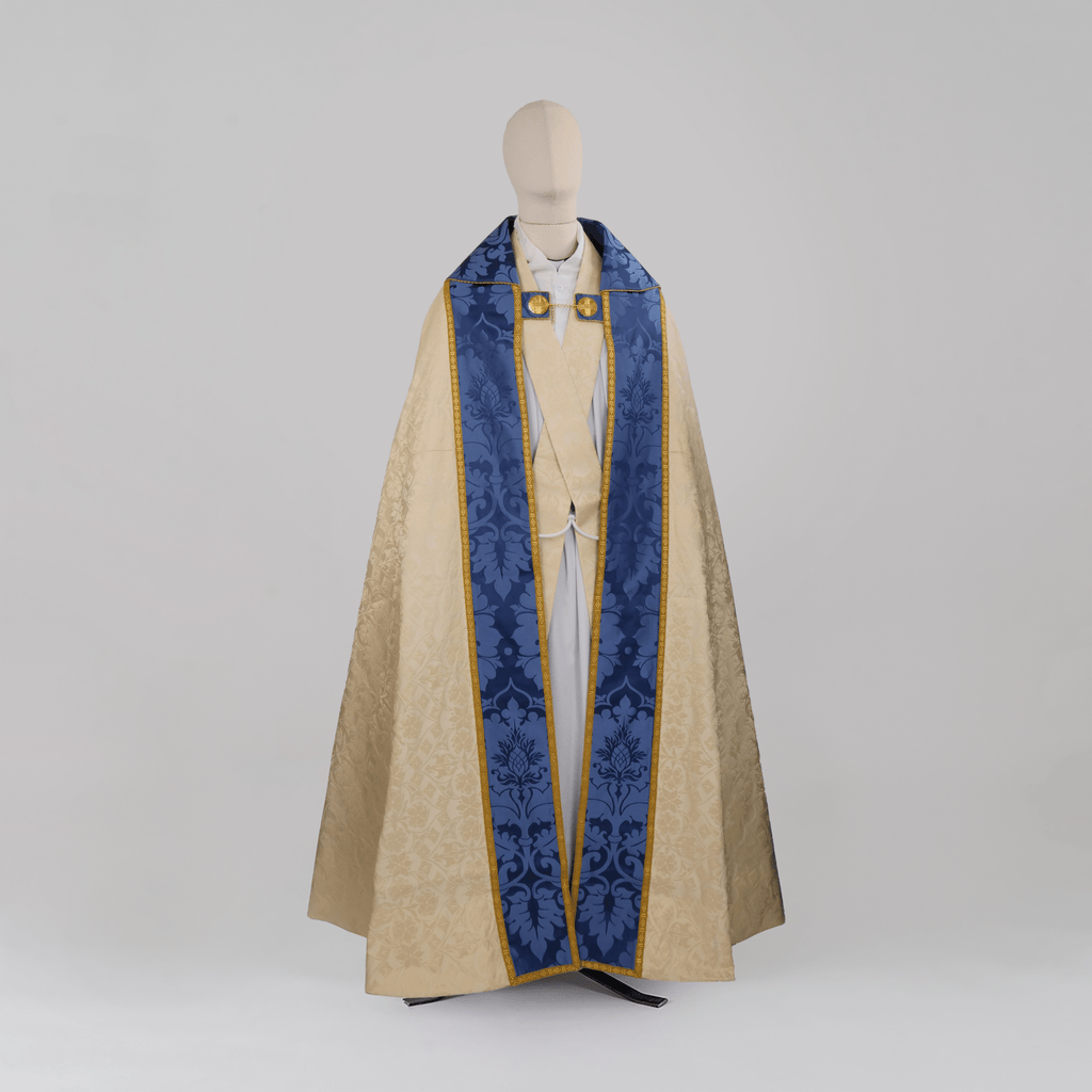 Minster Cope in Cream 'St John' Damask with Blue 'Bellini' Orphreys and Lamb of Gold Embroidered Hood - Watts & Co.
