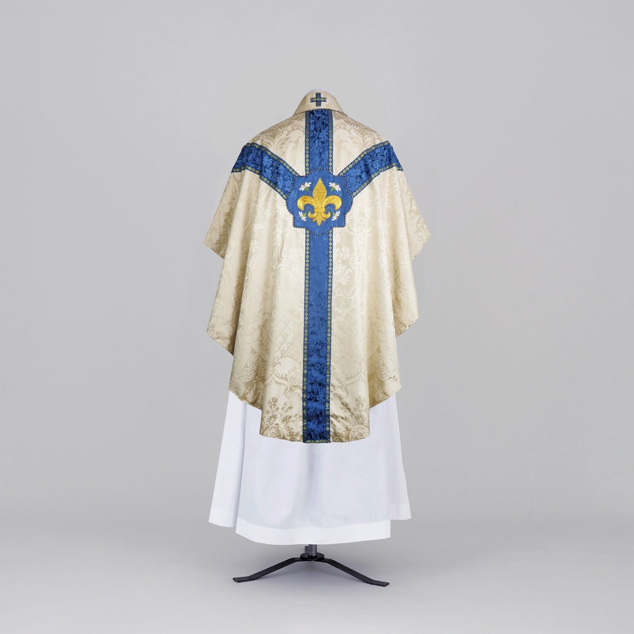 Semi - Gothic Chasuble in Cream 'Comper Cathedral' Silk Damask with Blue 'Hilliard' Orphreys and Fleur du Lys Embroidery - Watts & Co.