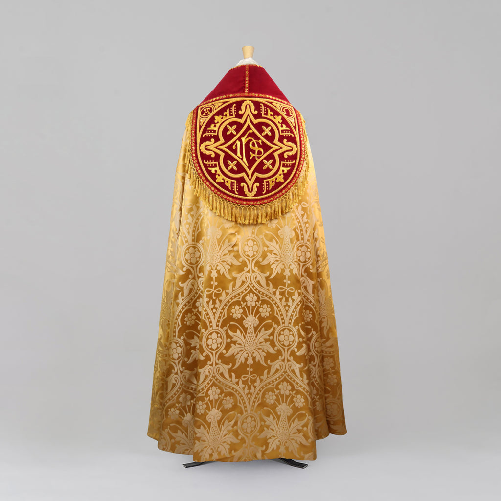 Westminster Cope in Gold/Cream 'Shrewsbury' with Berry 'Venice' Velvet orphreys and an IHS Hand - Embroidered Hood - Watts & Co.