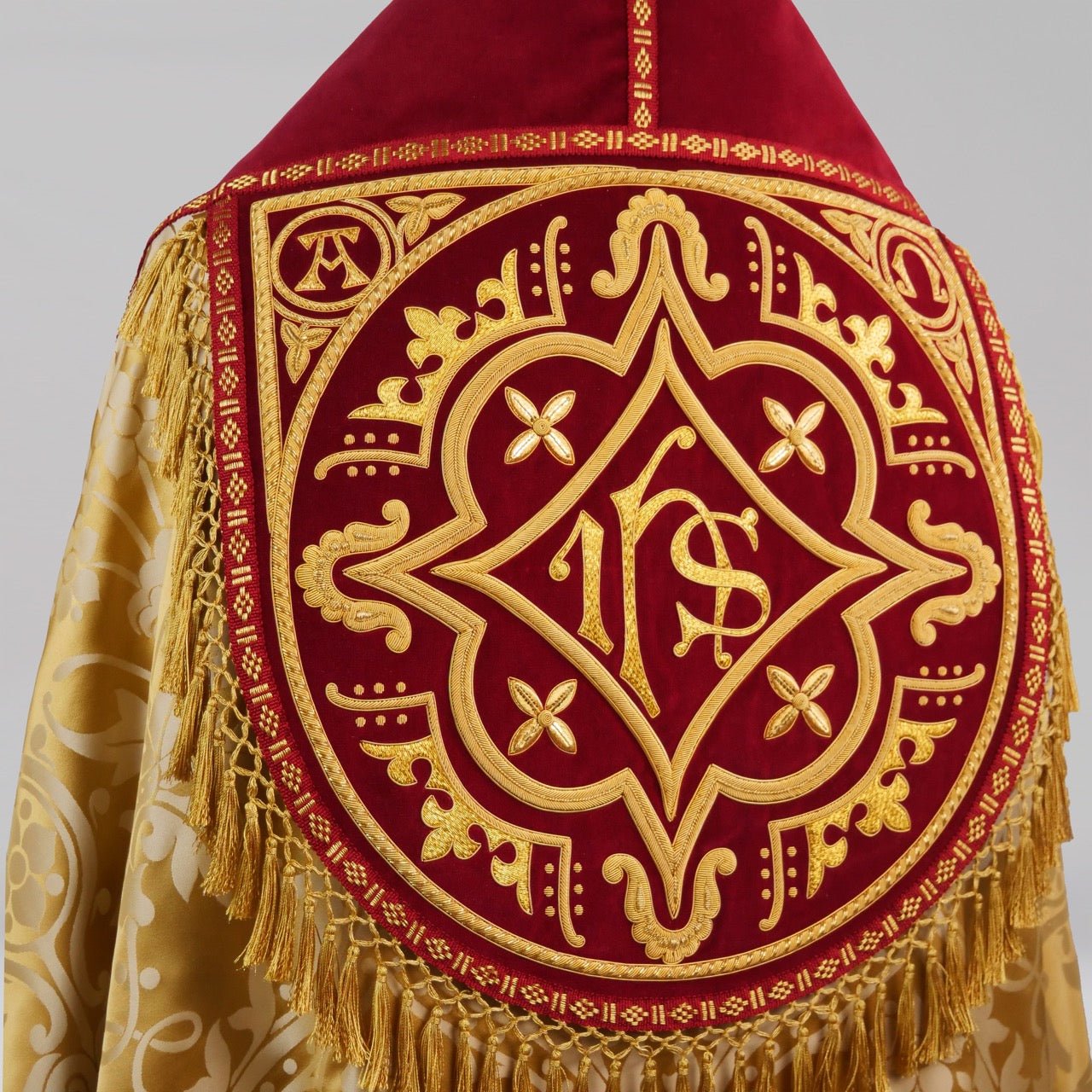 Westminster Cope in Gold/Cream 'Shrewsbury' with Berry 'Venice' Velvet orphreys and an IHS Hand - Embroidered Hood - Watts & Co.